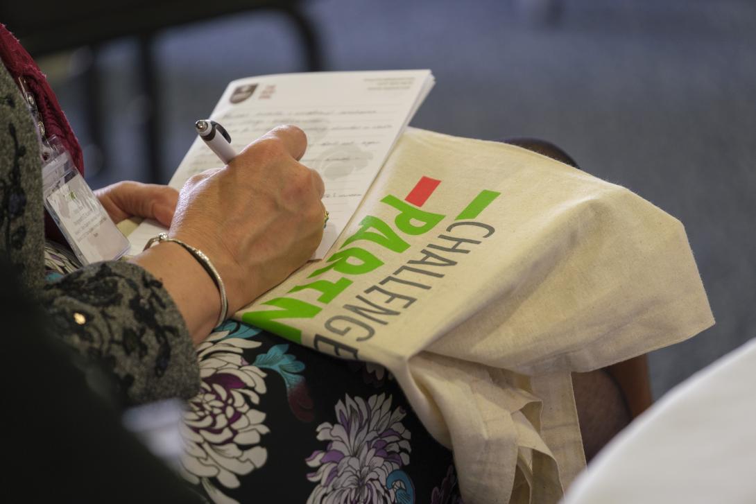Challenge Partners tote bag at an event